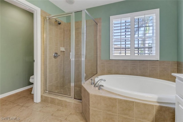 full bathroom featuring a stall shower, baseboards, toilet, tile patterned floors, and a bath