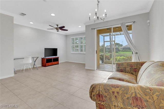 living area with recessed lighting, crown molding, baseboards, and ceiling fan with notable chandelier