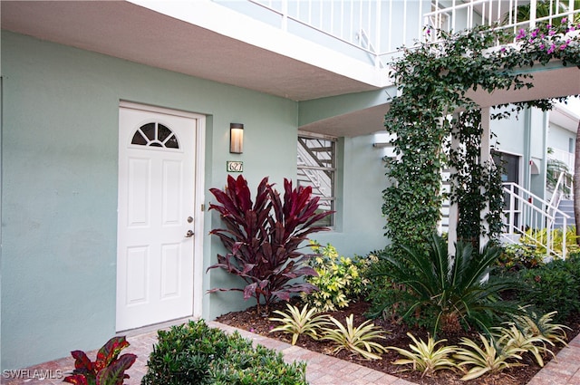 doorway to property featuring a balcony