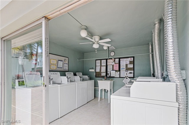 clothes washing area featuring washing machine and clothes dryer, ceiling fan, and light tile patterned floors