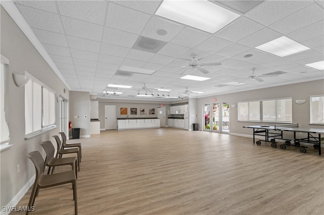 miscellaneous room with ceiling fan, a paneled ceiling, and light hardwood / wood-style floors