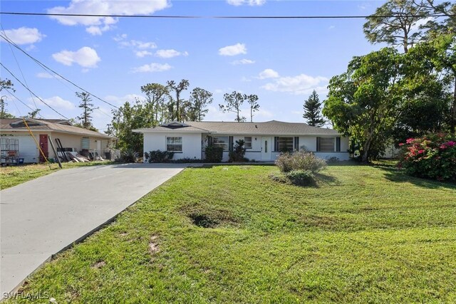 single story home with a front lawn