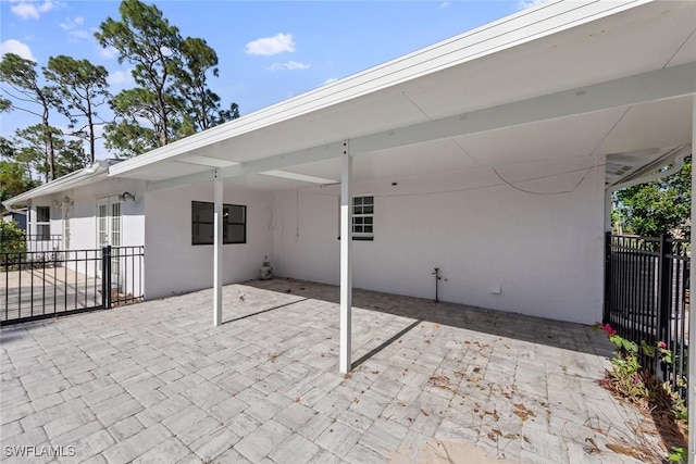 view of patio / terrace featuring a carport