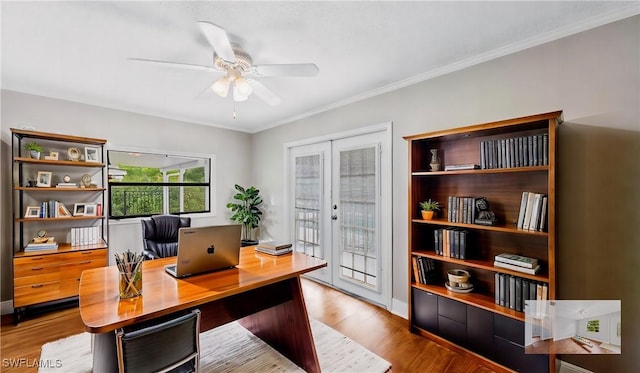 home office with french doors, ceiling fan, ornamental molding, and light hardwood / wood-style flooring