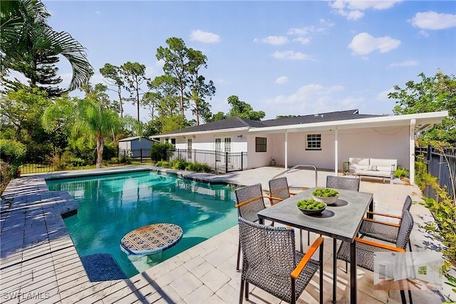 view of swimming pool with outdoor lounge area and a patio