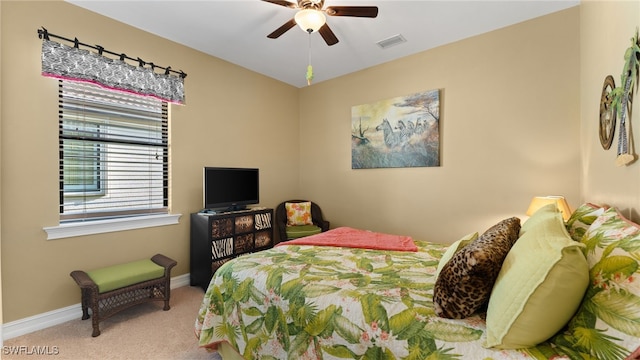 carpeted bedroom featuring ceiling fan