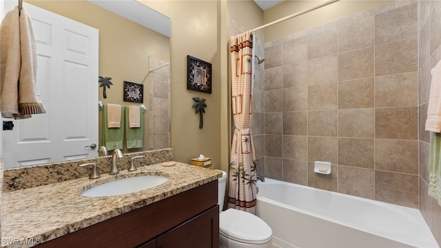 full bathroom featuring vanity, shower / bath combination with curtain, and toilet