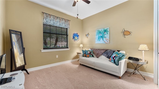 carpeted living room featuring ceiling fan