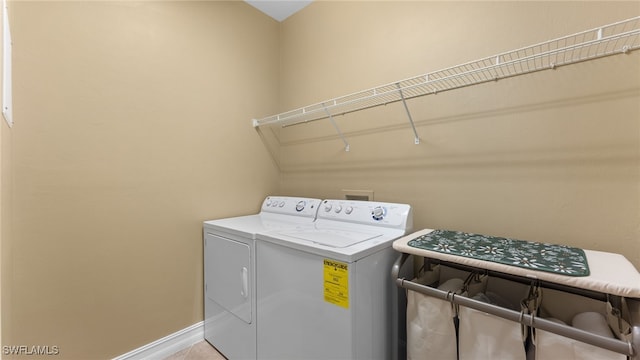 laundry area with independent washer and dryer