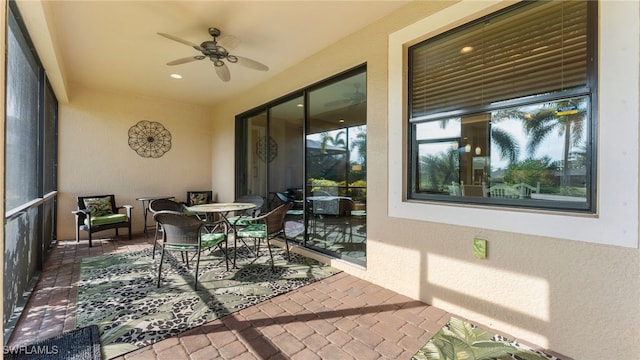 exterior space featuring ceiling fan and a healthy amount of sunlight