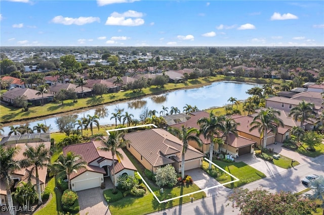 birds eye view of property featuring a water view