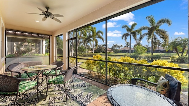 sunroom / solarium with ceiling fan