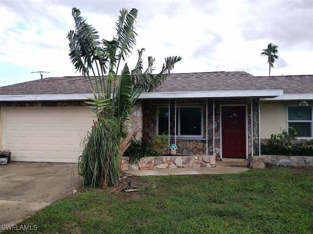 single story home with a garage and a front yard