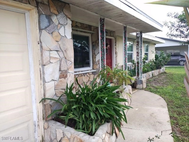 property entrance with covered porch