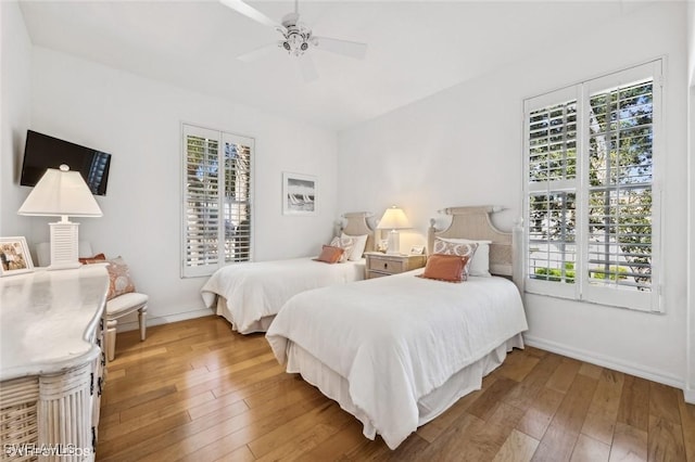 bedroom featuring ceiling fan and hardwood / wood-style floors