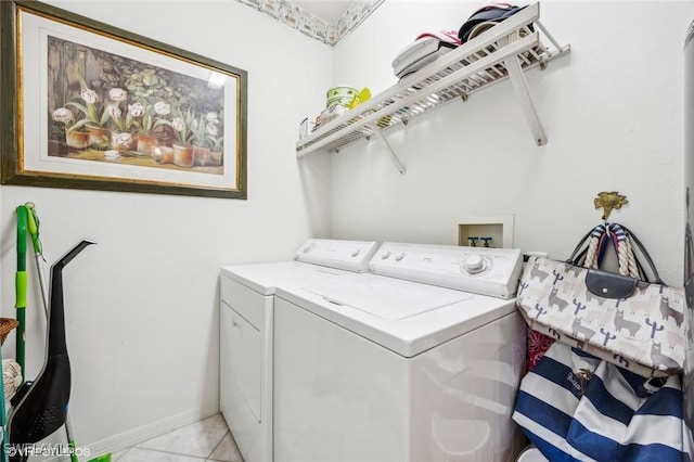 washroom with independent washer and dryer and light tile patterned floors