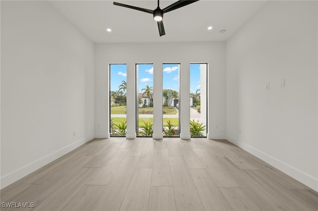 empty room featuring light hardwood / wood-style floors and ceiling fan