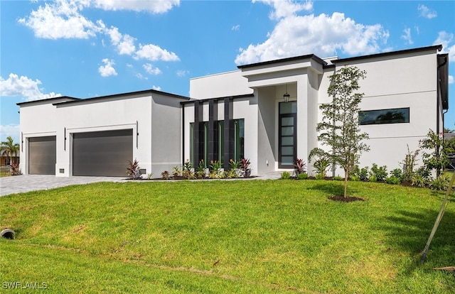 modern home with a front lawn and a garage