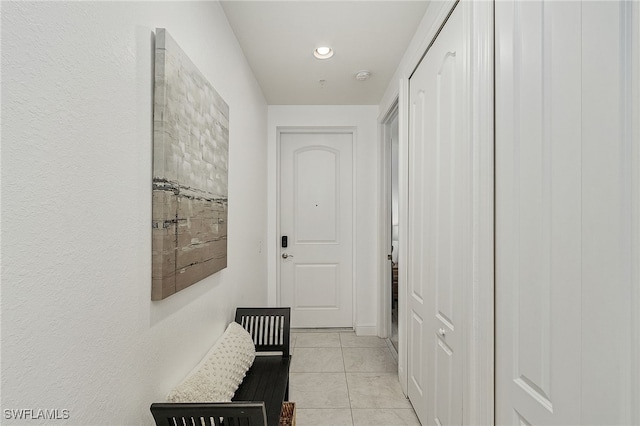 hallway with light tile patterned flooring