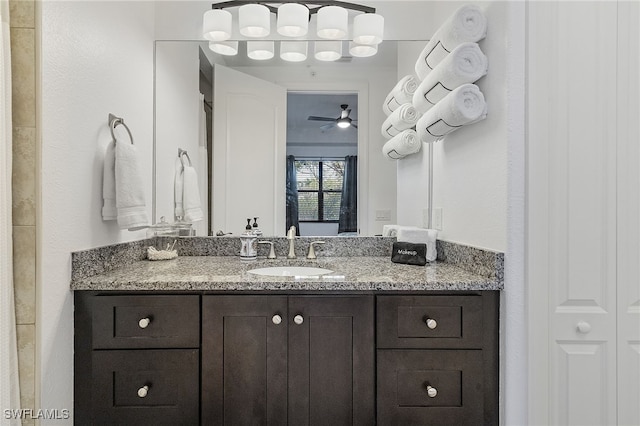 bathroom featuring ceiling fan and vanity