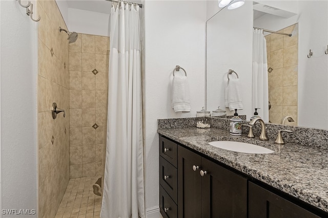 bathroom with vanity and a shower with shower curtain