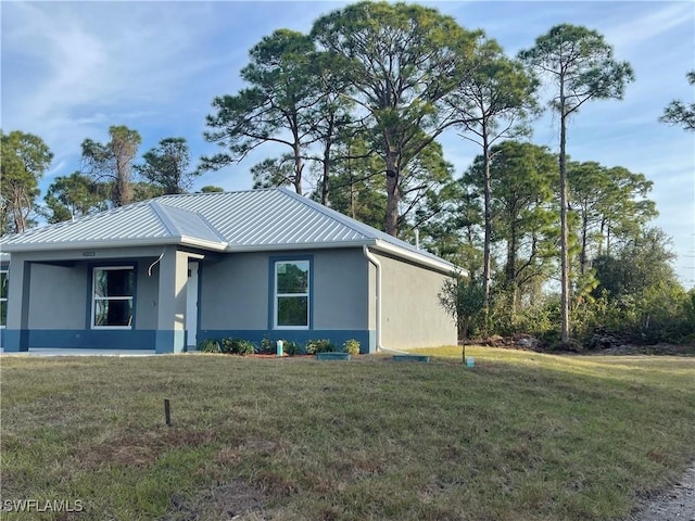 view of side of home featuring a yard