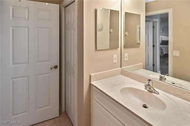 bathroom featuring tile patterned flooring and vanity