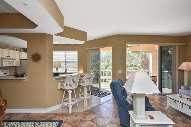 interior space with ceiling fan