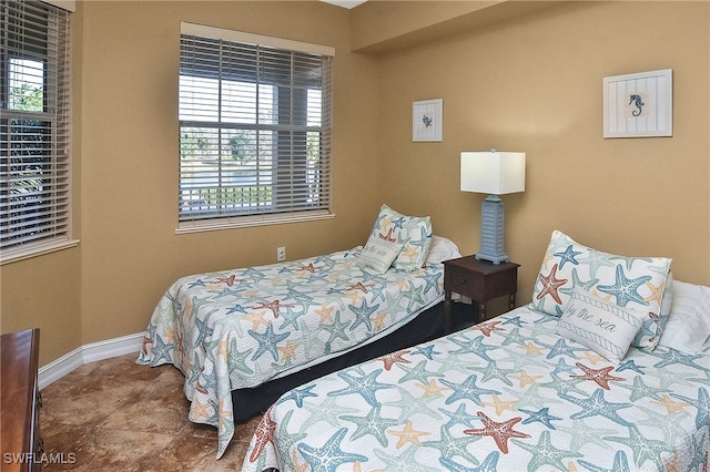 bedroom featuring multiple windows