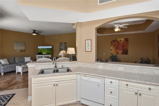 kitchen featuring ceiling fan, light tile patterned floors, sink, kitchen peninsula, and dishwasher