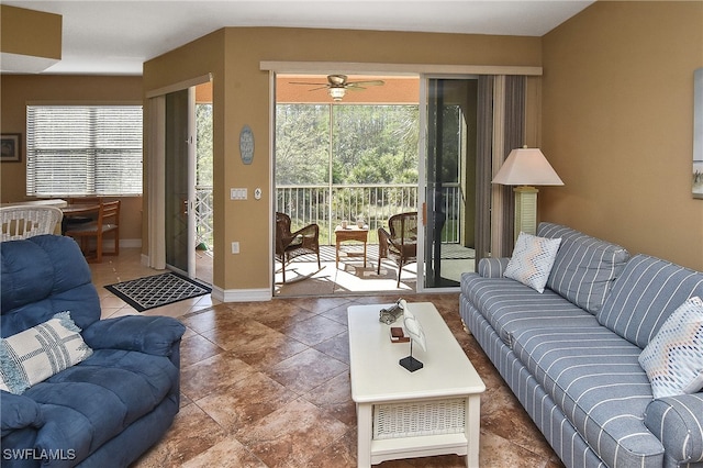 living room featuring ceiling fan and plenty of natural light