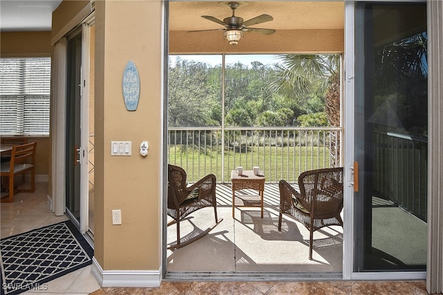 exterior space with ceiling fan