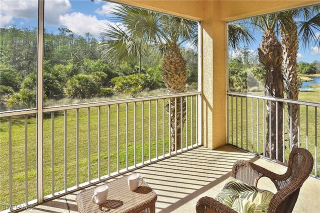 balcony featuring a water view