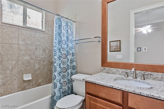 full bathroom with ceiling fan, vanity, shower / tub combo, crown molding, and toilet