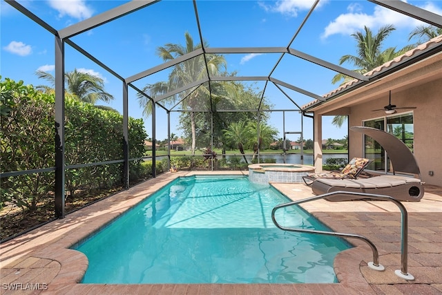 view of pool with ceiling fan, a patio, glass enclosure, and an in ground hot tub