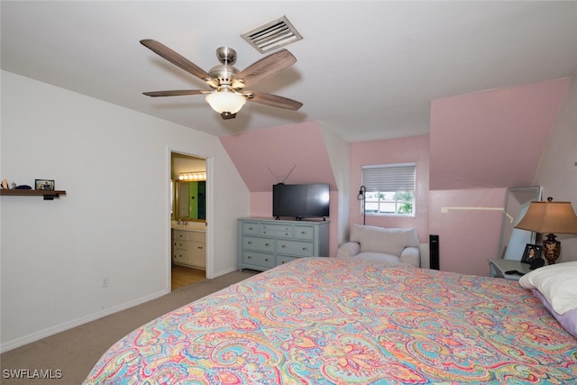 carpeted bedroom with lofted ceiling, ensuite bath, and ceiling fan