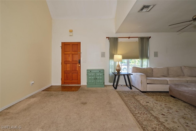 carpeted living room with ceiling fan