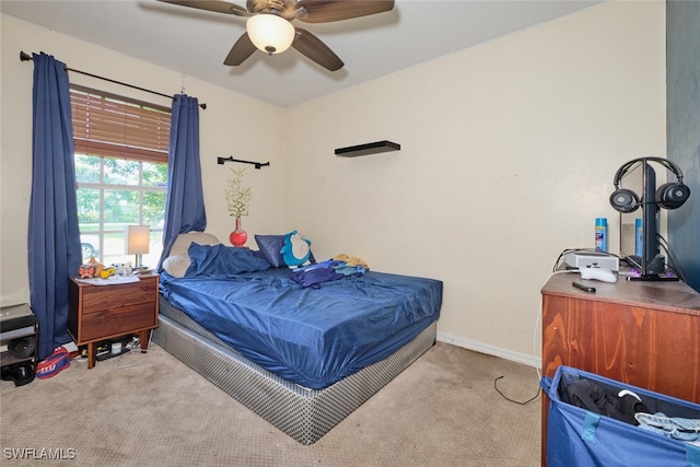 bedroom featuring ceiling fan and light colored carpet