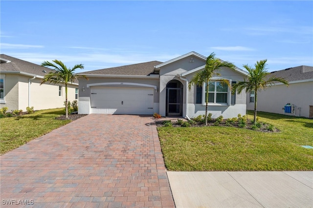 single story home with a front yard and a garage