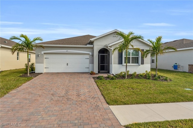 ranch-style home with a garage and a front lawn