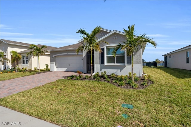 view of front of house with a front lawn and a garage