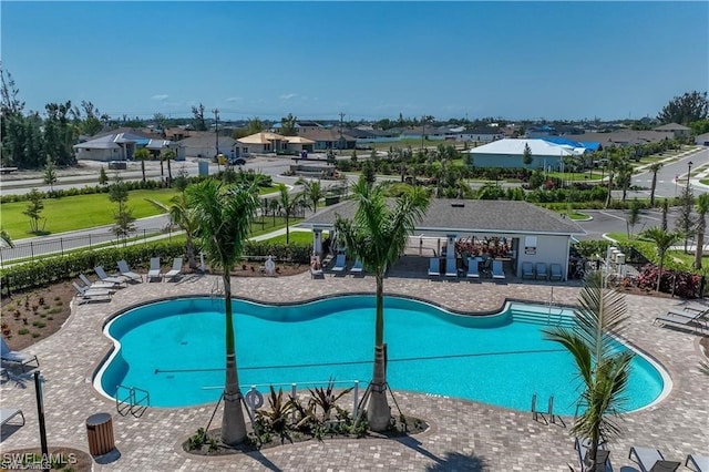 view of swimming pool featuring a patio area