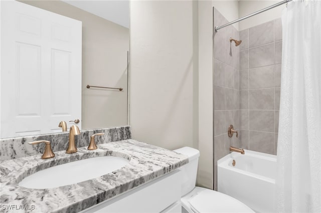 full bathroom featuring vanity, shower / bath combination with curtain, and toilet