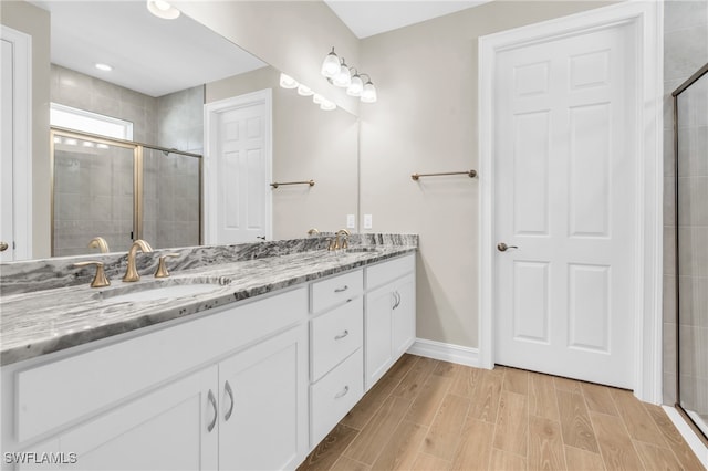 bathroom featuring vanity and walk in shower