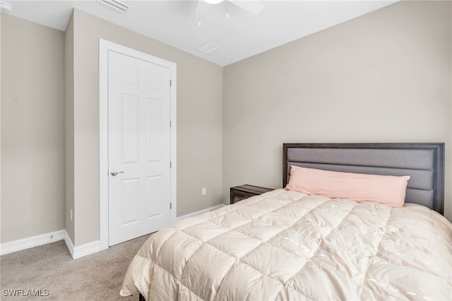 carpeted bedroom featuring ceiling fan