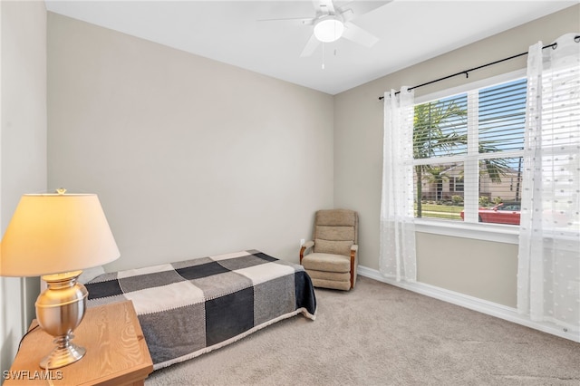 bedroom with light colored carpet and ceiling fan