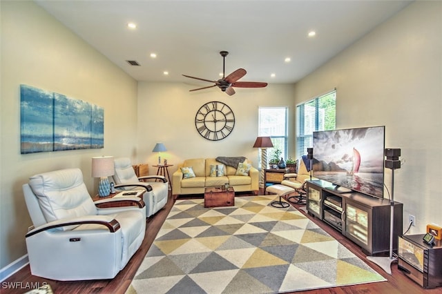 living room featuring ceiling fan and hardwood / wood-style flooring