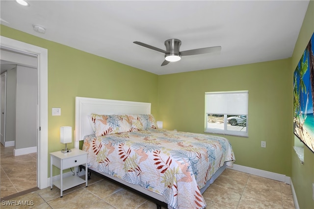 bedroom with light tile patterned flooring and ceiling fan