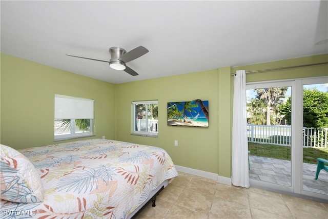 bedroom featuring access to outside, light tile patterned flooring, and ceiling fan