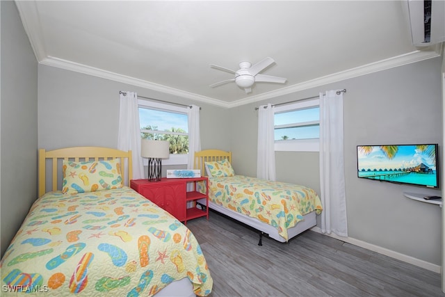 bedroom featuring ceiling fan, multiple windows, hardwood / wood-style floors, and crown molding